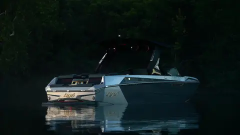 Moody rear boat frame with reflection, but the overall image is dark.