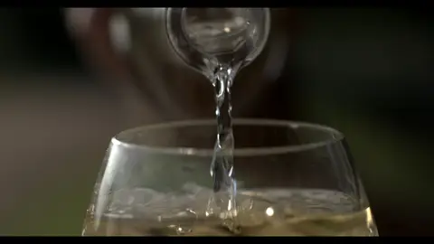 Third-pass frame candidate. Source-level review: Bottle, pour, and glass frames are composed and polished, but this is alcohol/product-label material rather than core GLM machine imagery. Individual frame still requires close visual review unless source-level decision is reject.