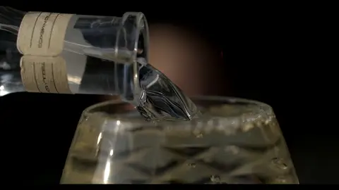Third-pass frame candidate. Source-level review: Bottle, pour, and glass frames are composed and polished, but this is alcohol/product-label material rather than core GLM machine imagery. Individual frame still requires close visual review unless source-level decision is reject.
