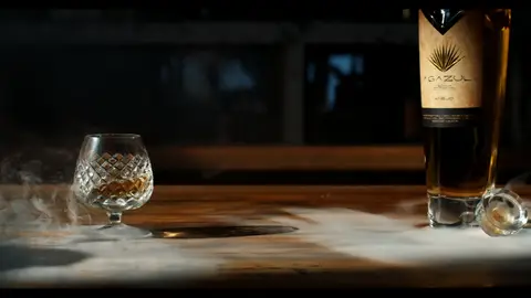 Third-pass frame candidate. Source-level review: Bottle, pour, and glass frames are composed and polished, but this is alcohol/product-label material rather than core GLM machine imagery. Individual frame still requires close visual review unless source-level decision is reject.