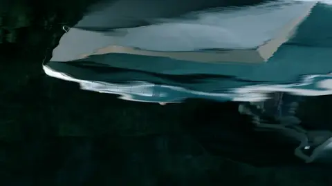 Third-pass frame candidate. Source-level review: Good water, boat, wake, and outdoor motion frames. Some faces, property, and boat/brand context still need review. Individual frame still requires close visual review unless source-level decision is reject.