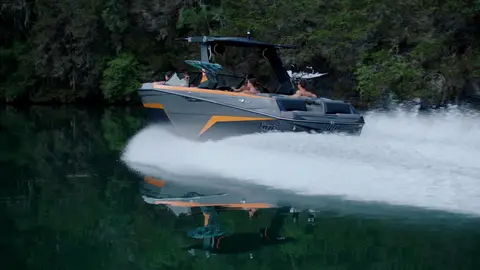 Third-pass frame candidate. Source-level review: Good water, boat, wake, and outdoor motion frames. Some faces, property, and boat/brand context still need review. Individual frame still requires close visual review unless source-level decision is reject.