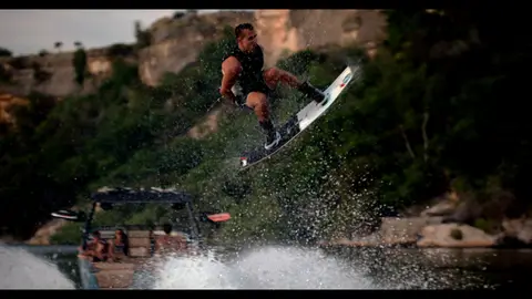 Third-pass frame candidate. Source-level review: Good water, boat, wake, and outdoor motion frames. Some faces, property, and boat/brand context still need review. Individual frame still requires close visual review unless source-level decision is reject.