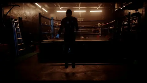 Third-pass frame candidate. Source-level review: Dramatic boxing silhouettes and ring atmosphere, but many frames are very dark, motion-heavy, or face/athlete dependent. Individual frame still requires close visual review unless source-level decision is reject.