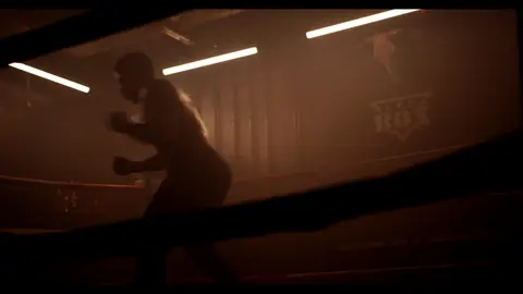 Third-pass frame candidate. Source-level review: Dramatic boxing silhouettes and ring atmosphere, but many frames are very dark, motion-heavy, or face/athlete dependent. Individual frame still requires close visual review unless source-level decision is reject.