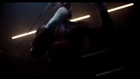 Third-pass frame candidate. Source-level review: Dramatic boxing silhouettes and ring atmosphere, but many frames are very dark, motion-heavy, or face/athlete dependent. Individual frame still requires close visual review unless source-level decision is reject.