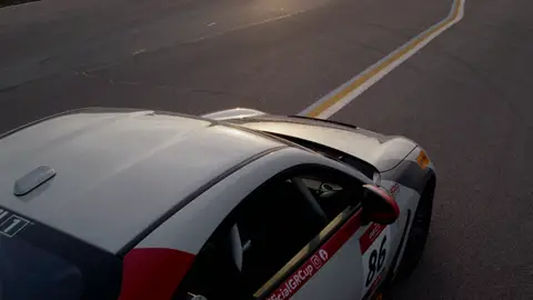 Third-pass frame candidate. Source-level review: Strong motorsport/car frames. This pass avoids the known muddy car-blur window and includes cleaner track, vehicle, and detail moments. Individual frame still requires close visual review unless source-level decision is reject.