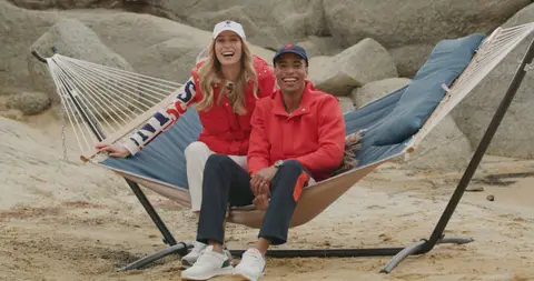 USPA Red Hoodie Hammock Couple. lifestyle visual reference, composition and color reference.