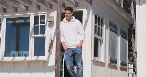 USPA White Hoodie Porch Portrait. lifestyle visual reference, composition and color reference.