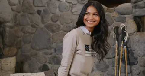 USPA Stone Fireplace Hoodie Portrait. lifestyle visual reference, composition and color reference.