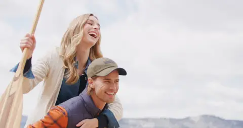 USPA Canoe Paddle Couple Laughing. marine_lifestyle visual reference, composition and color reference.