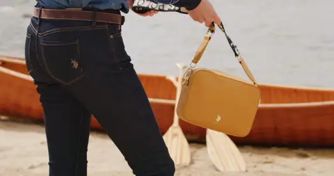 USPA Tan Handbag Canoe Detail. marine_lifestyle visual reference, composition and color reference.