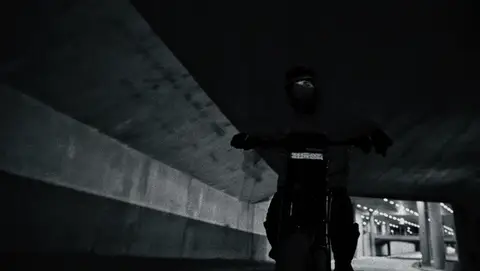 Monochrome Night Bike Ride GIF candidate generated from duplicate-guarded short-clip positions. Review for loop value, rider visibility, motion blur, location/property, and duplicate action beats.