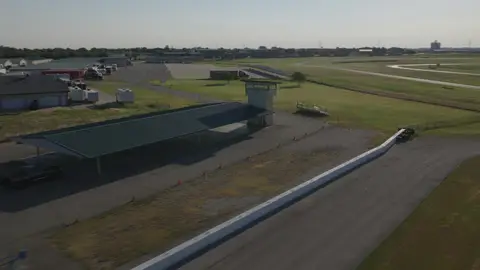 Useful aerial facility angle with track context, but less graphic than the wider and top-down selects.