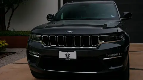 Front vehicle hero angle is usable but darker and less complete than the stronger full-vehicle options.