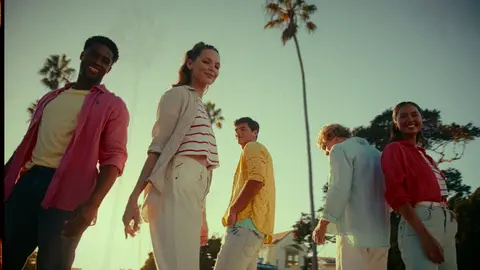 Strong group fashion hero with multiple models, wardrobe color, street context, and clean energy.